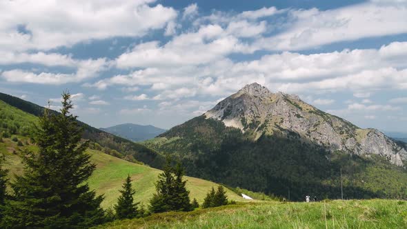 Hiking in Alpine Mountains Nature in Sunny Summer with White Clouds on Blue Sky Landscape