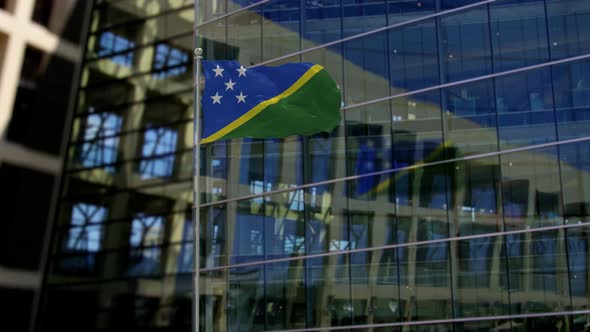 Solomon Islands Flag Waving On A Skyscraper Building