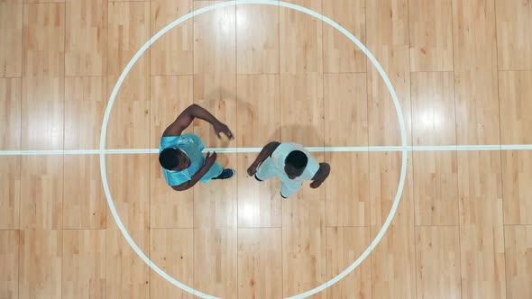 Africanamerican Opponents are Playing Basketball in a Top View