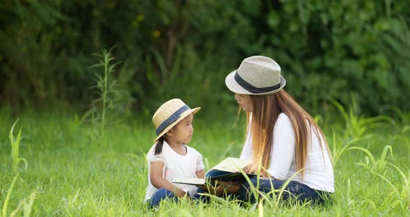 Mom and daughter reading a book