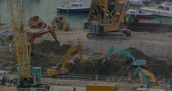 In Hong Kong, China are going construction work - excavators digging ground