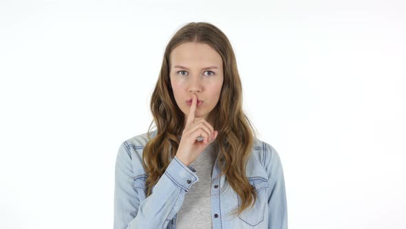 Woman with Finger on Lips Asking for Silence