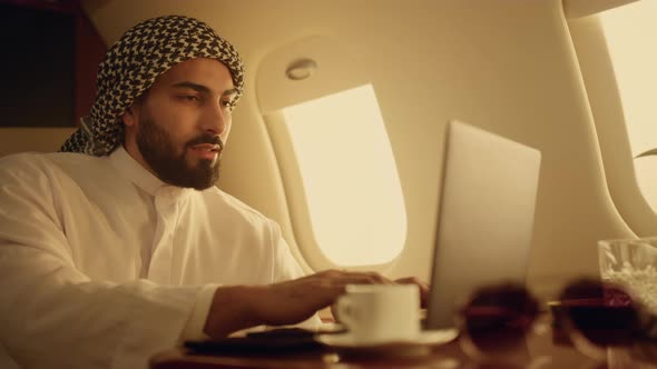 Positive Ceo Typing Laptop on Business Trip Closeup