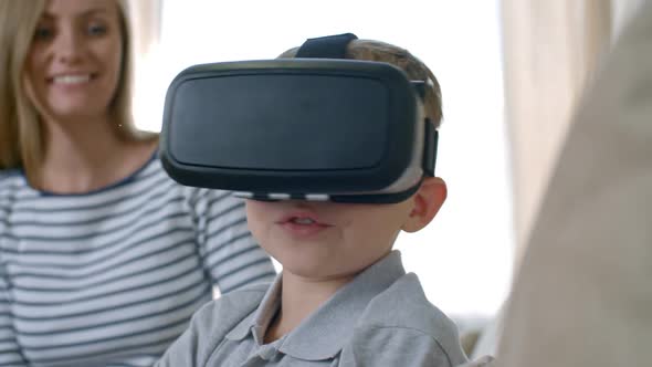 Mother Watching Son Experiencing Virtual Reality