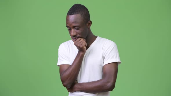 Young Happy African Man Smiling with Arms Raised