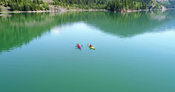 People kayaking in lake 4k