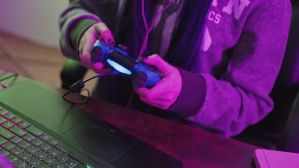 Young European Brunette Focused on Her Computer Game Medium Closeup