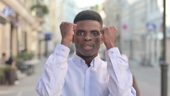 Portrait of Attractive African Man Screaming Shouting