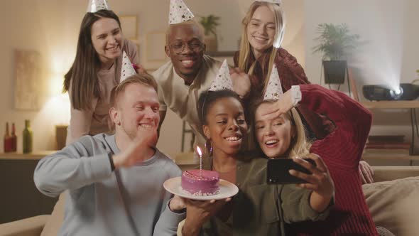 Diverse Group of People Taking Selfie with Birthday Cake