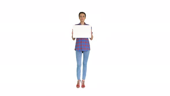Attractive Woman Shows Blank White Poster on White Background.
