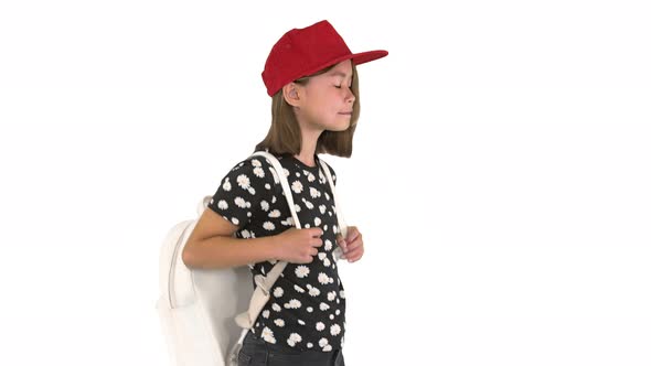 Happy Asian Schoolgirl with Backpack Walking on White Background