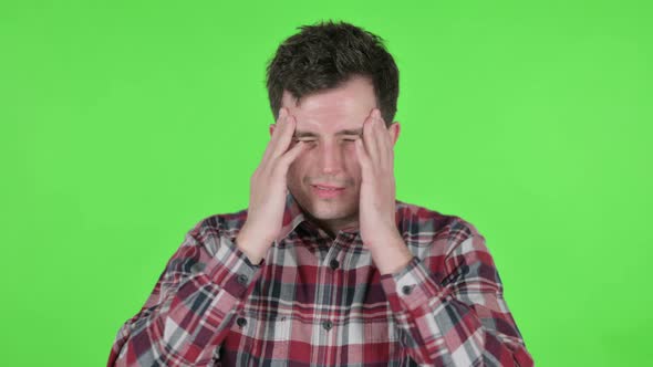 Portrait of Young Man Having Headache Green Chroma Screen