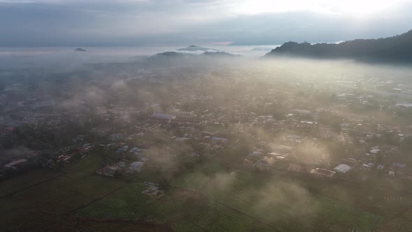 Aerial view morning mist at Malays village