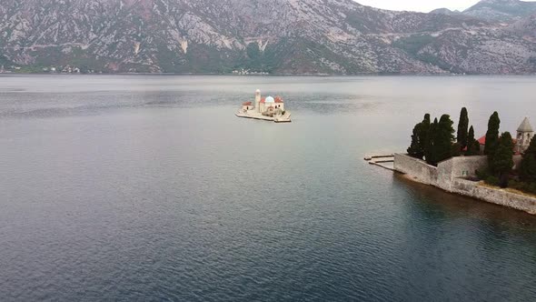 A Little Island with a Small Old Church and Trees in the Sea