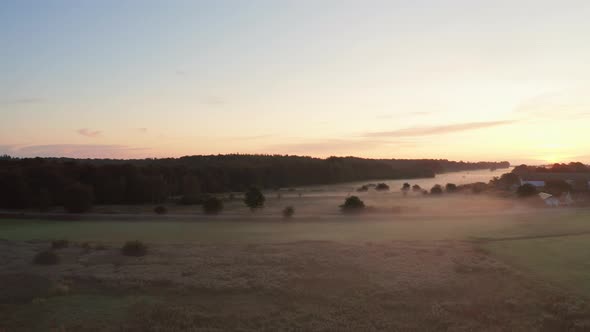 Panoramic Aerial Shot of Djursland Landscape and Golden Skies in Background