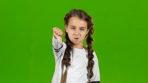 Little One Is Showing the Finger Down. Green Screen