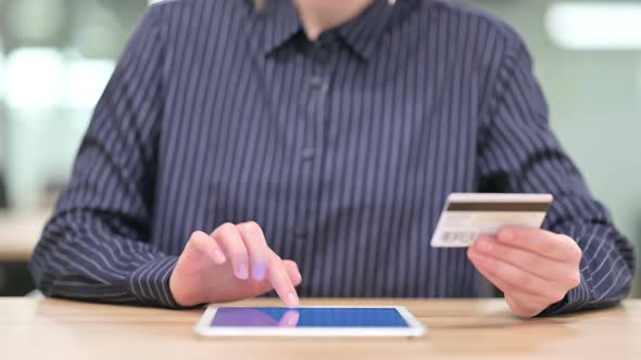 Close Up of Businesswoman Making Online Payment on Tablet