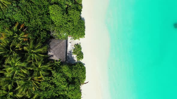 Beautiful flying copy space shot of a summer white paradise sand beach and aqua blue ocean backgroun