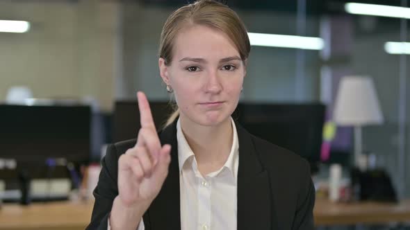 Portrait of Attractive Young Businesswoman Saying No By Finger