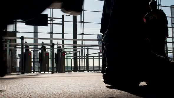 Silhouettes of People Walking by Gates at Airport Terminal, Flight, Bottom View
