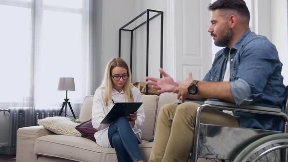 Professional Female Medical Nurse Listening About Problems and Feeling of Male Patient