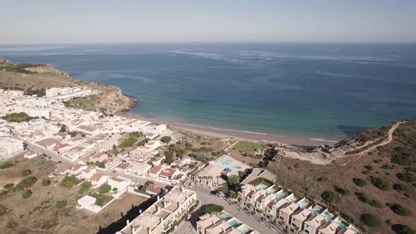 Aerial of waterfront holiday homes in Burgau, Algarve, Portugal