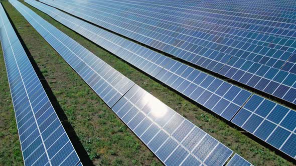 Lines of Solar Panels on Green Eco Electric Solar Energy Farm