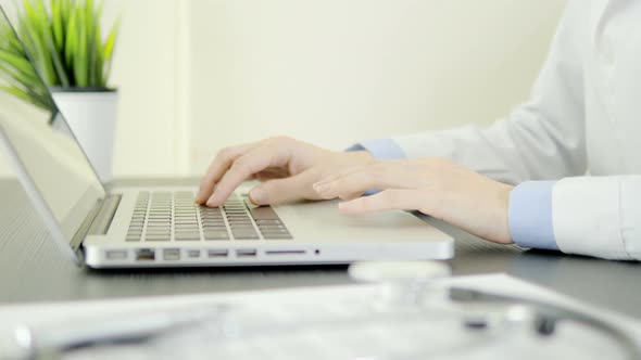 Doctor Using Laptop