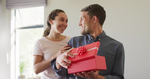 Happy young caucasian couple in love spending valentines day at home