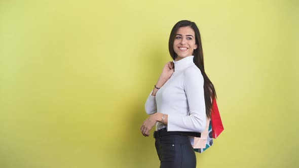 Fashion Woman Turning Around in Slow Motion with Shopping Bags