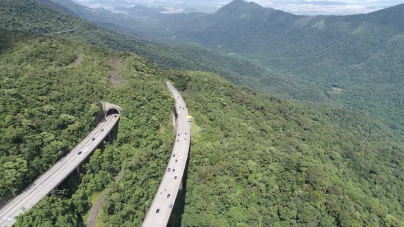 Construction landscape of highway road between green mountains.