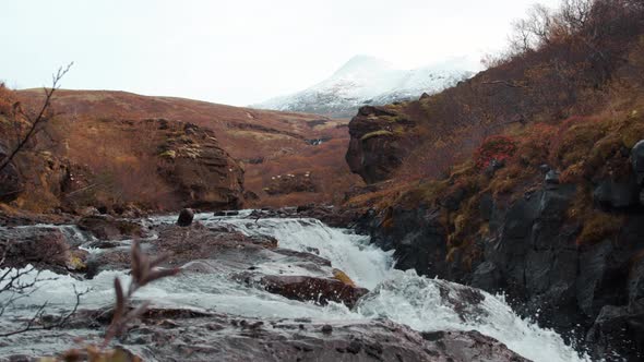 Water Splashing In Waterfall Over Rocks