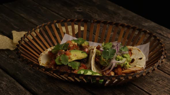 Rotating shot of delicious tacos on a wooden surface - BBQ 152