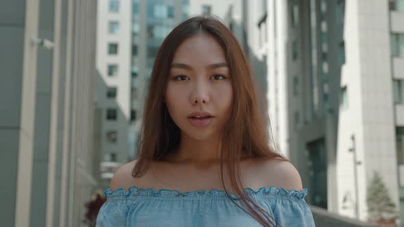 Portrait of Amazed Asian Girl Student with Bare Shoulders Female Shocked Saying WOW of the Business