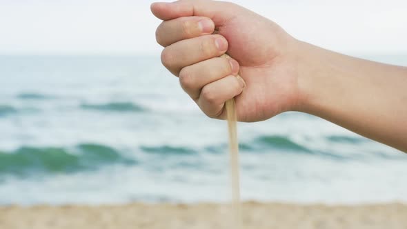 Sand Strewed by Hand at Beach