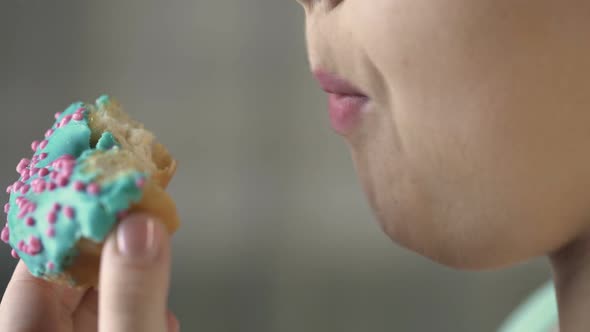 Closeup Video of Chubby Woman Eating Doughnut With Appetite, Unhealthy Food