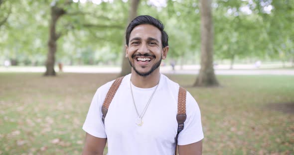 Portrait of laughing man in public park