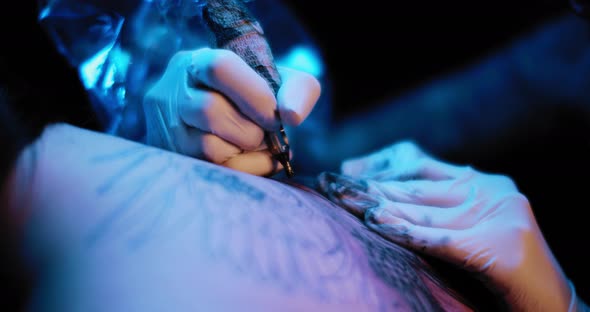 Close up of a tattoo artist making someone a tattoo drawing. BMPCC 4K
