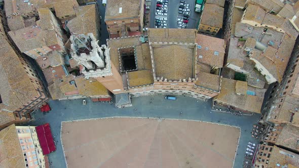 Flying over Piazza del Campo - main public space of the historic center of Siena