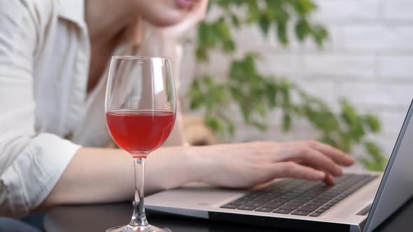 Woman at Remote Office with Wine