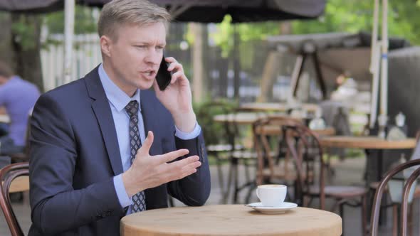 Angry Businessman Yelling on Phone