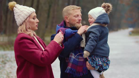 Young Family Walking in the Park