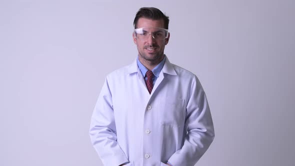 Young Hispanic Man Doctor Wearing Protective Glasses