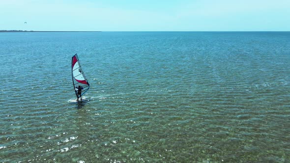 Aerial View Alone Surfer Sliding Calm Sea on Windsurf