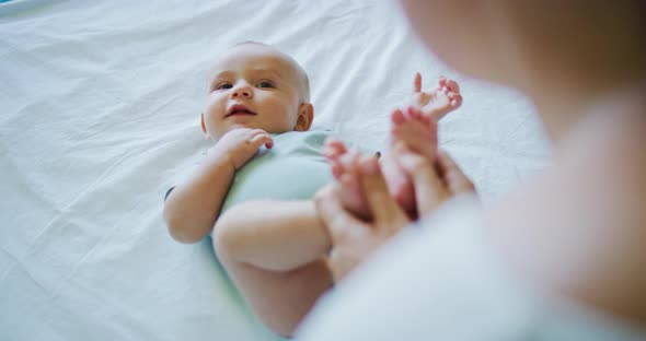 Mother Playing with Young Baby