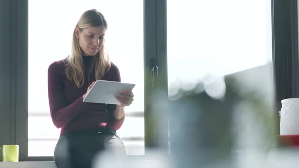 Businesswoman using tablet in office