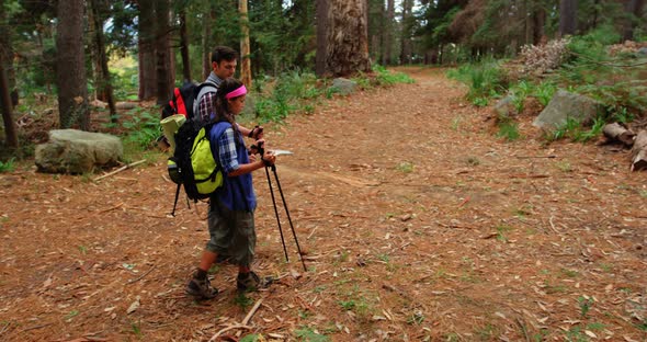 High angle view of hiker couple searching their direction