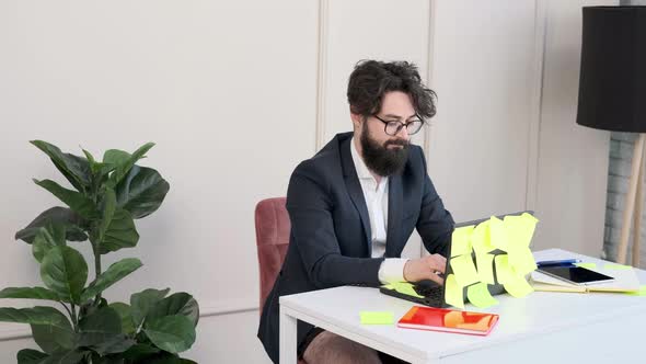 Bearded Man in Underwear and Jacket Working Remote Typing at Computer