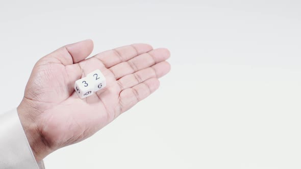 Hand Holds Numbered Dice   Three And Two Thirty Two