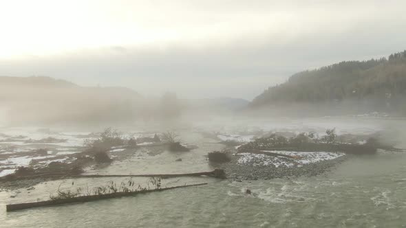 Aerial View of Chilliwack River with Snow During Winter Season